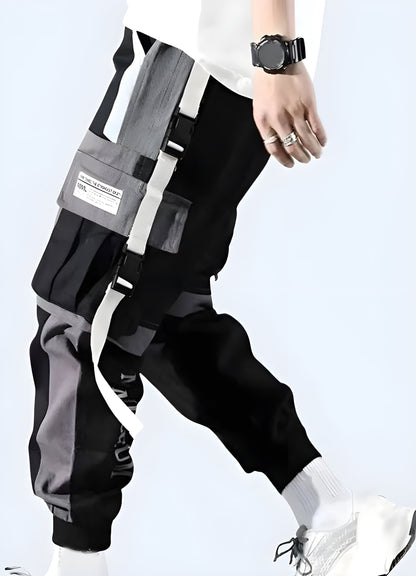 Side view of a man wearing sleek black techwear pants, showcasing the garment's streamlined silhouette and innovative materials, perfect for fashion-conscious tech lovers in the UK.