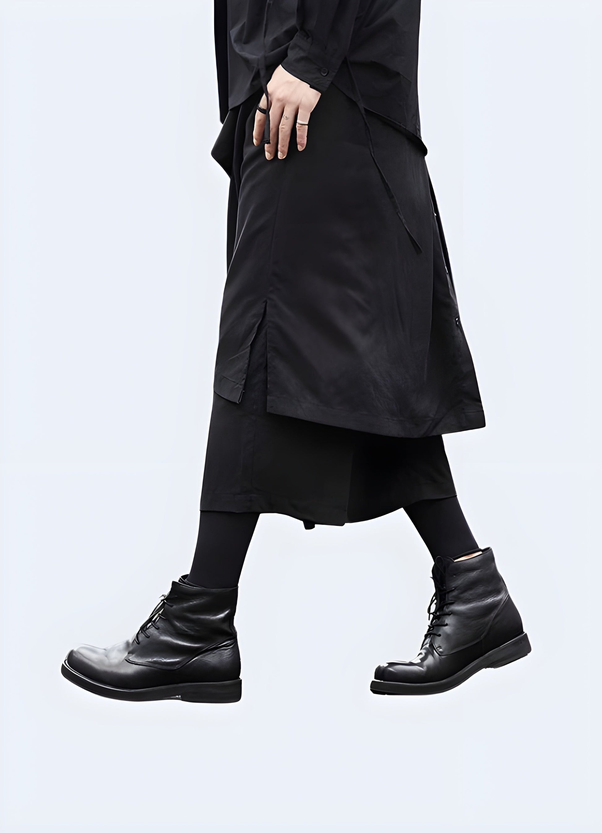  Side view of a man modeling stylish hakama pants for streetwear, highlighting the fusion of traditional Japanese elements with contemporary urban fashion, ideal for fashion-forward individuals in the UK.