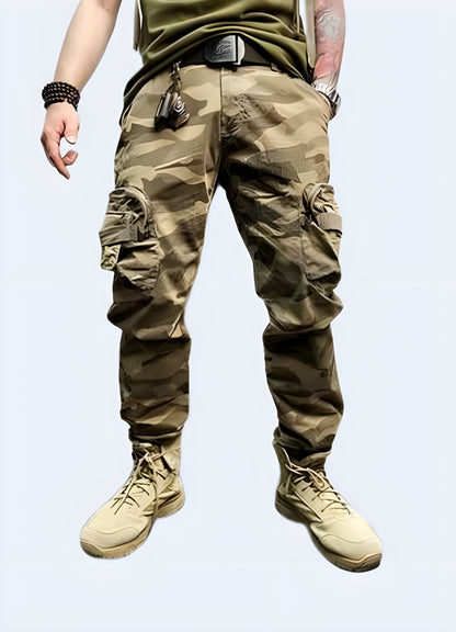 Front view of a man modeling on-trend baggy camo cargo pants, highlighting the spacious pockets and loose silhouette, a must-have for UK fashion enthusiasts seeking a statement-making streetwear look.