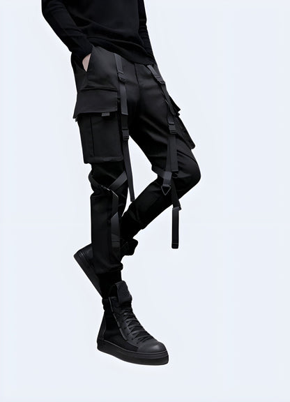 Side view of a man modeling trendy darkwear pants, showcasing the garment's slim fit and unique design elements, perfect for fashion-forward individuals in the UK embracing the dark fashion aesthetic.