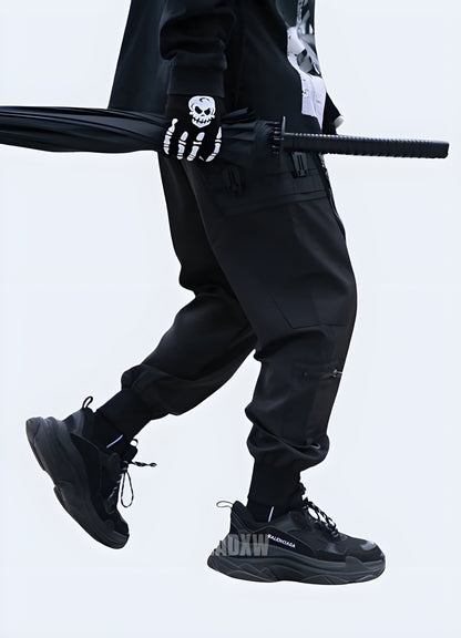  Side view of a man modeling stylish Japanese streetwear pants, showcasing the garment's exceptional fit and cutting-edge style, perfect for fashion-forward individuals in the UK.