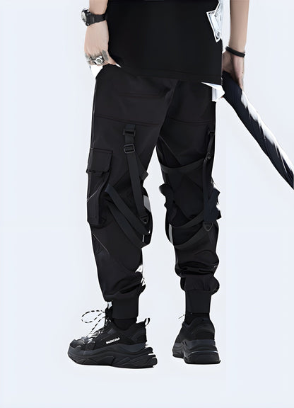  Back view of a man wearing fashionable ninja cargo pants, showcasing the garment's streamlined silhouette and practical pocket placement, perfect for fashion-forward individuals in the UK seeking a unique, ninja-inspired look.