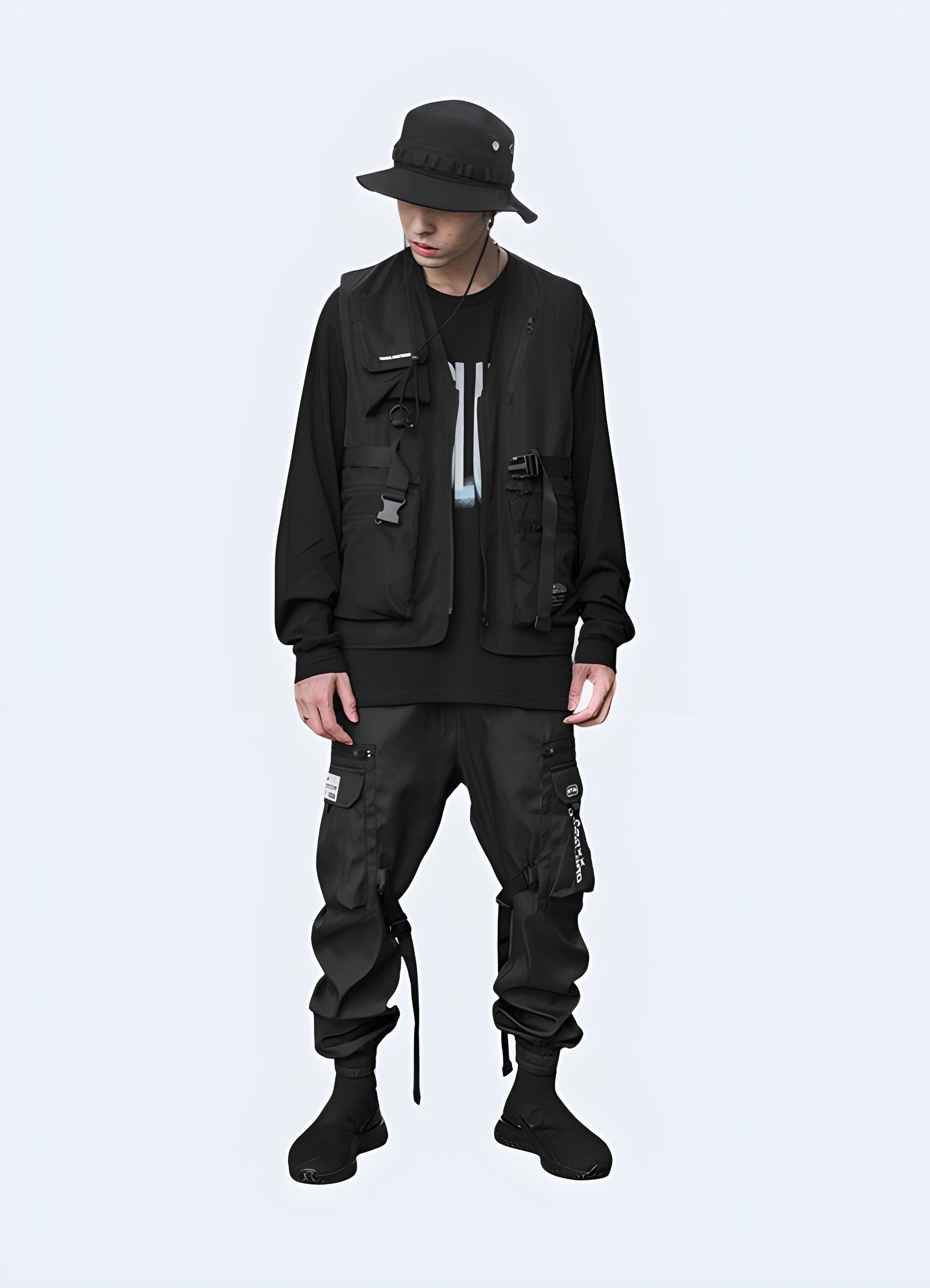 Man wearing a streetwear tactical vest, full body front view, highlighting its modern aesthetics and versatility for UK streetwear enthusiasts.