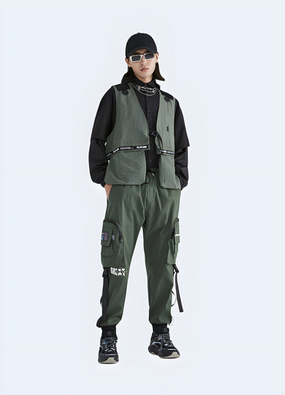 Front view of a man wearing high-performance tactical techwear cargo trousers, showcasing the advanced materials and functional design, perfect for UK tech enthusiasts and outdoor adventurers.