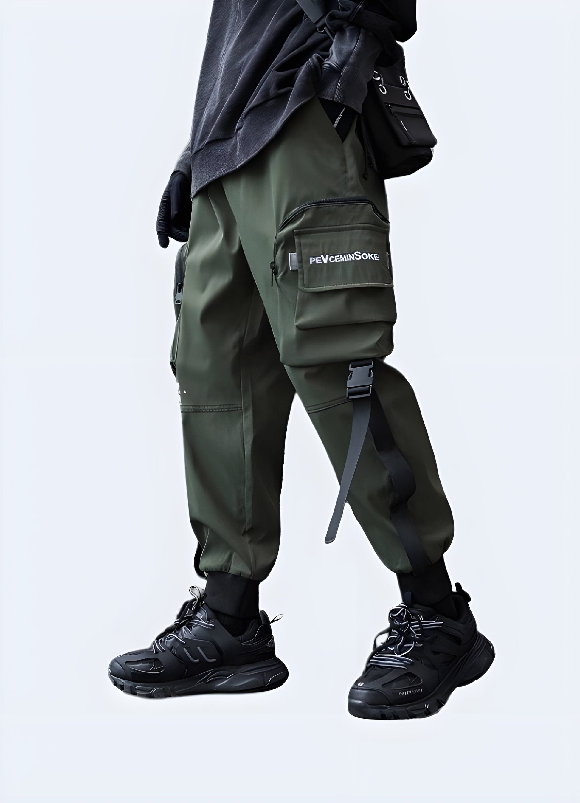 Left view of a man modeling innovative techwear cargo trousers, highlighting the premium materials and functional features, a must-have for tech-savvy individuals in the UK.