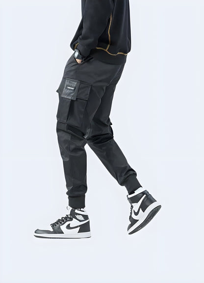 Side view of a man wearing high-performance techwear jeans, showcasing the garment's sleek aesthetics and functional features, perfect for tech-savvy fashion enthusiasts in the UK.