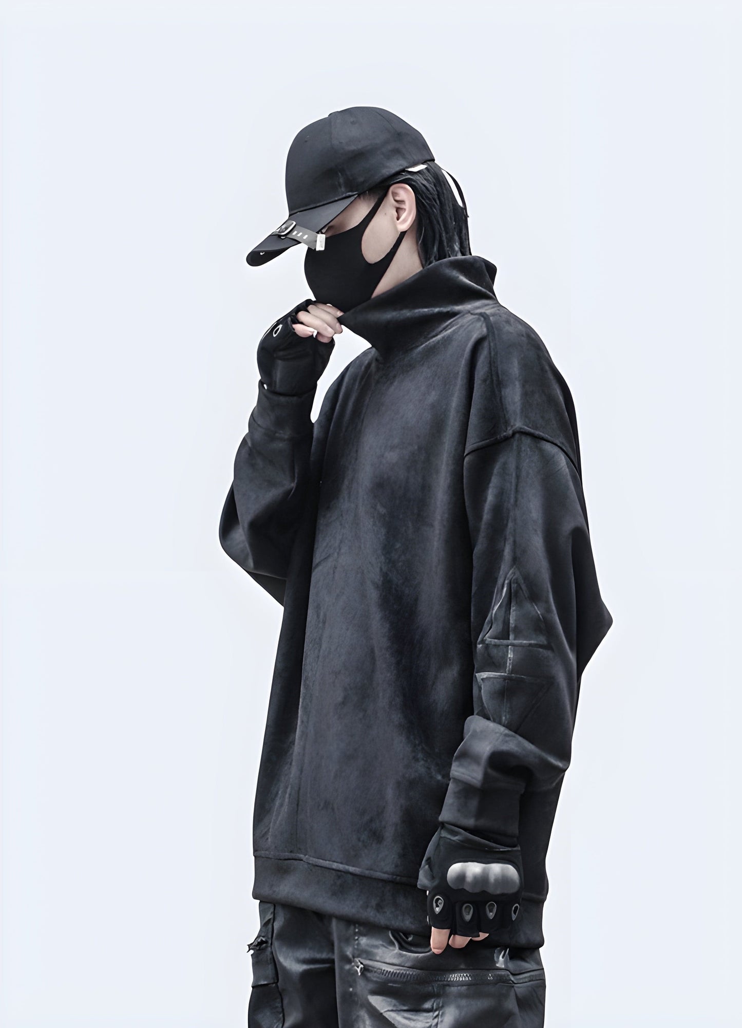 Side view of a man wearing a cutting-edge techwear pullover, showcasing its sleek silhouette in the UK.