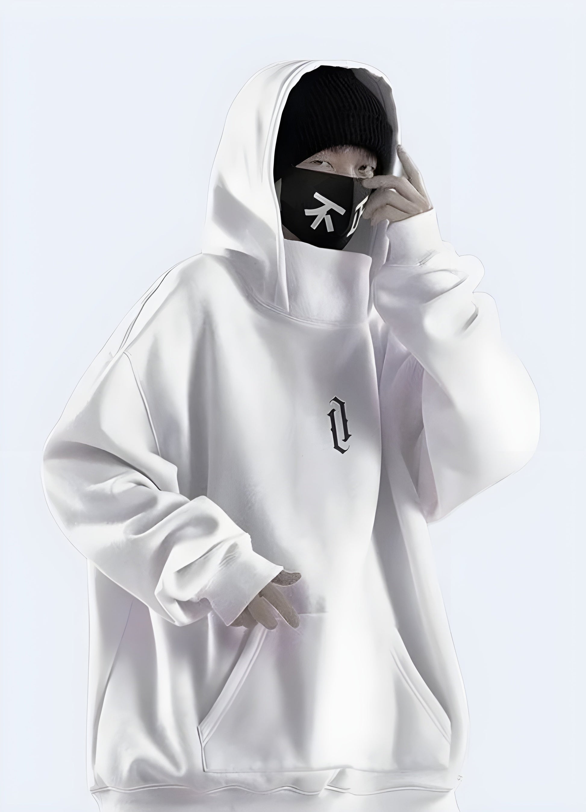 A man wearing a white high collar hoodie, showing the front view of the garment in the UK.