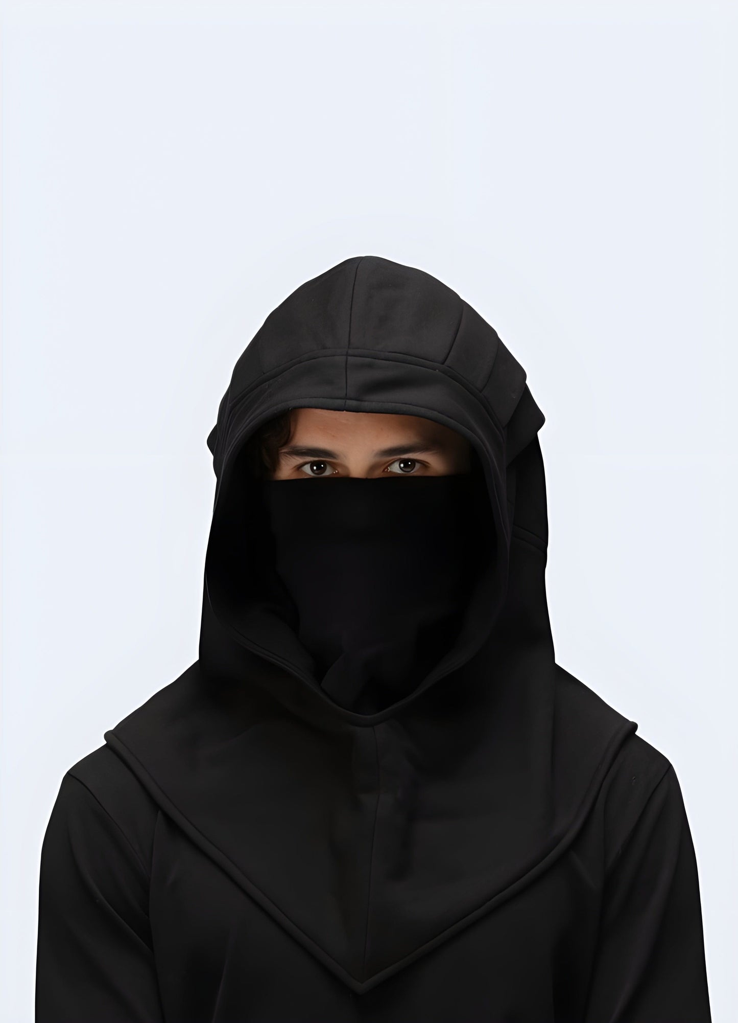 Front view of a man donning a trendy black techwear hood, highlighting its contemporary style and functional features, ideal for UK streetwear.