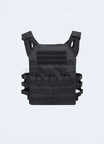 Black military-style tactical vest with multiple pockets and patches, worn by the artist Scarlxrd, featuring a distinctive design suitable for streetwear and fashion.